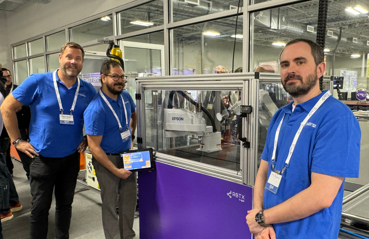 Industrial Robot Help engineers demoing IRH Advanced HMI System for Epson SCARA robot at RBTX Customer Test Area grand opening.