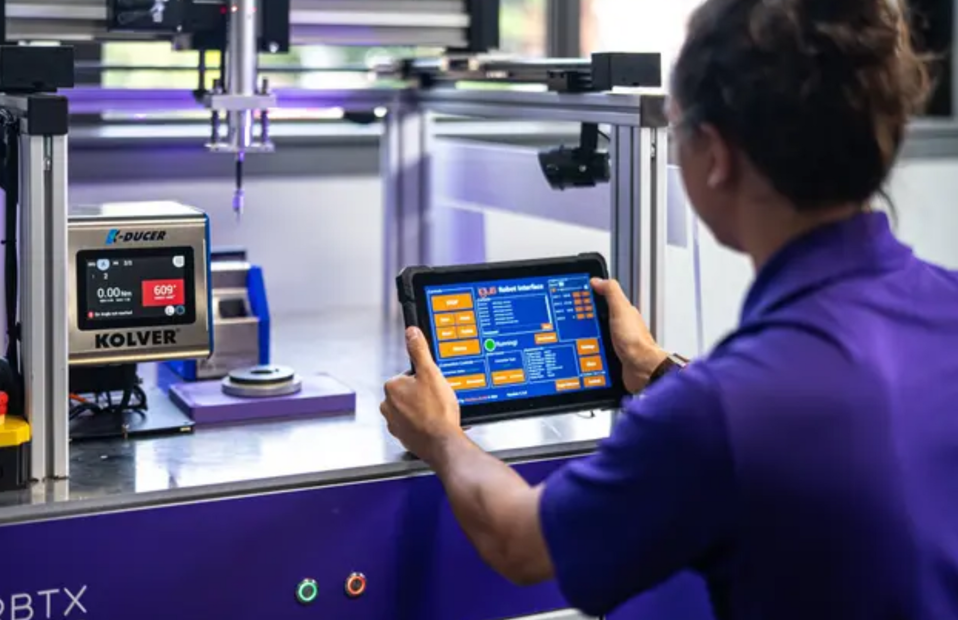 Automation specialist using IRH Advanced HMI system to control  and monitor gantry robot.