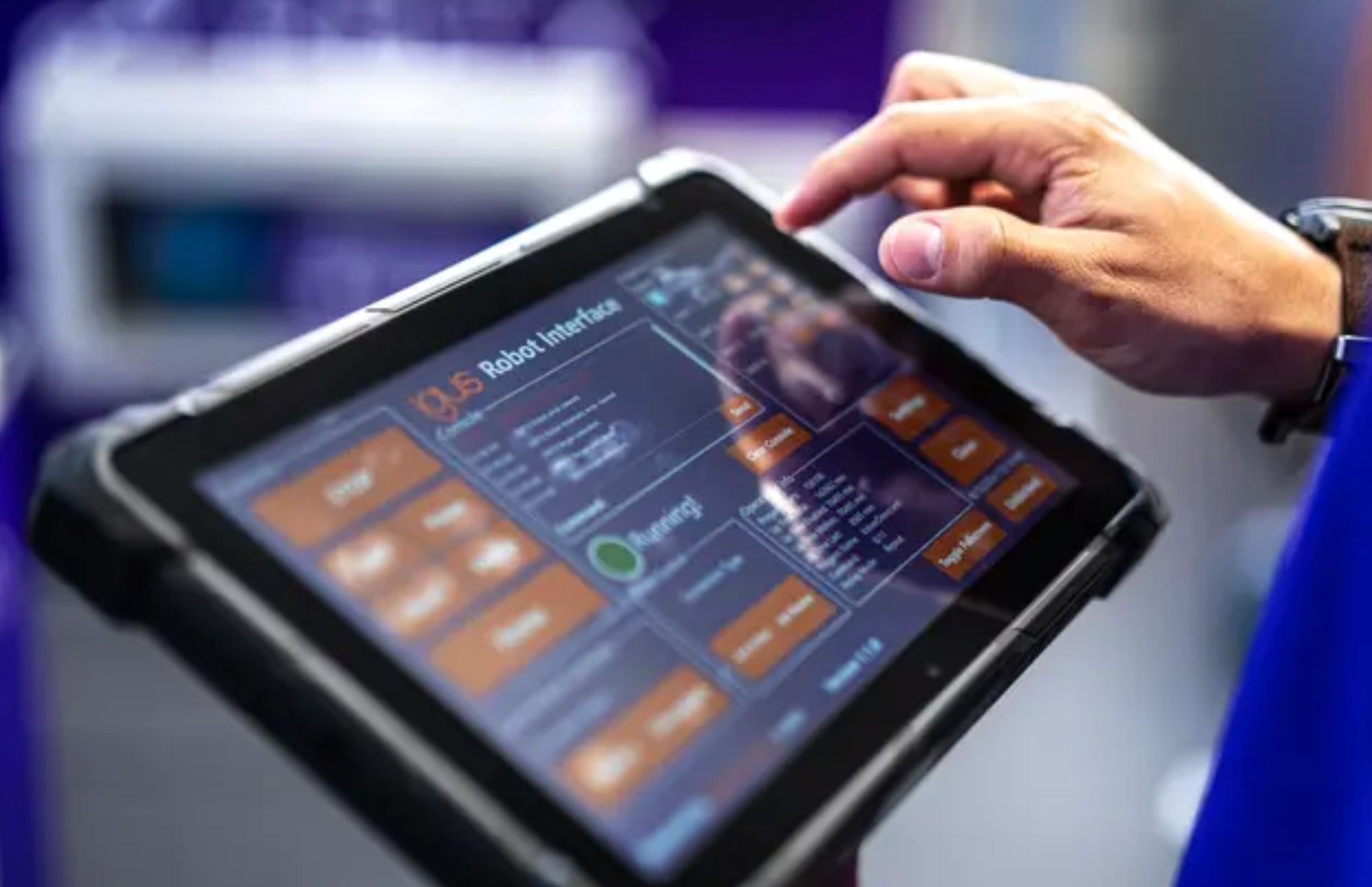 Touchscreen tablet HMI displaying real-time robot status and production metrics